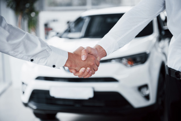 Should I purchase additional insurance from my agent or the car dealership?